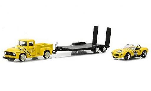 Ford F-1 1/64 Greenlight 00 yellow 1954 with Coventry Moteurs 289 Cobra and Flatbed Trailer diecast model cars